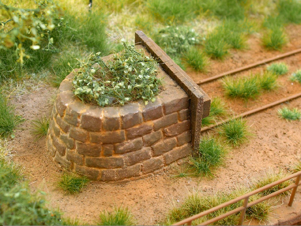 gemauerter Prellbock, halbrund, fertig patiniert, 1 Stück